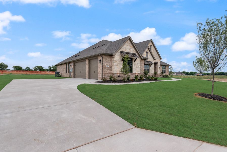 Front exterior of a new home in Paloma Ranch, New Fairview, TX, highlighting curb appeal (Image 16).