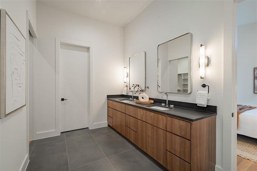 Bathroom featuring tile patterned flooring and vanity