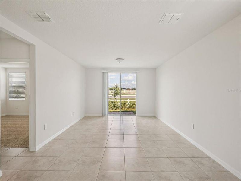 Spacious, unfurnished interior of a new home in Villamar - Signature Series, Winter Haven (Image 9).
