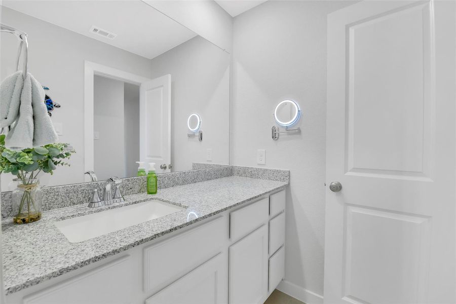 Long vanity with plenty of storage cabinet space.