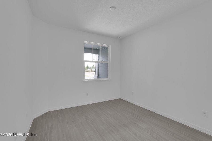 Spacious, unfurnished interior of a new home in Del Webb Wildlight, Yulee (Image 26).