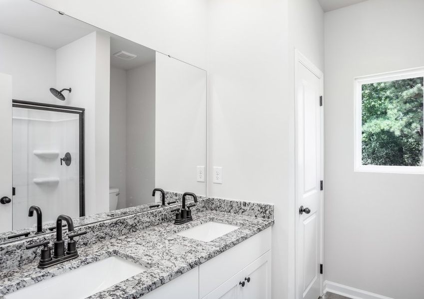 The master bathroom has double sinks
