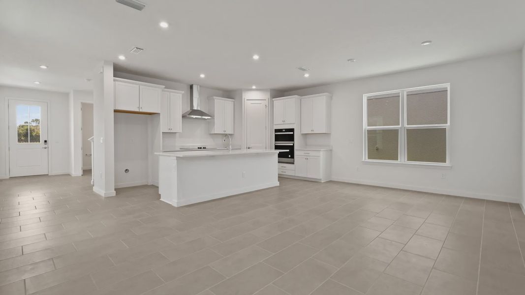 Spacious kitchen, living, and dining areas flow together seamlessly— DRB homes Spacious kitchen, living, and dining areas flow together seamlessly— DRB homes