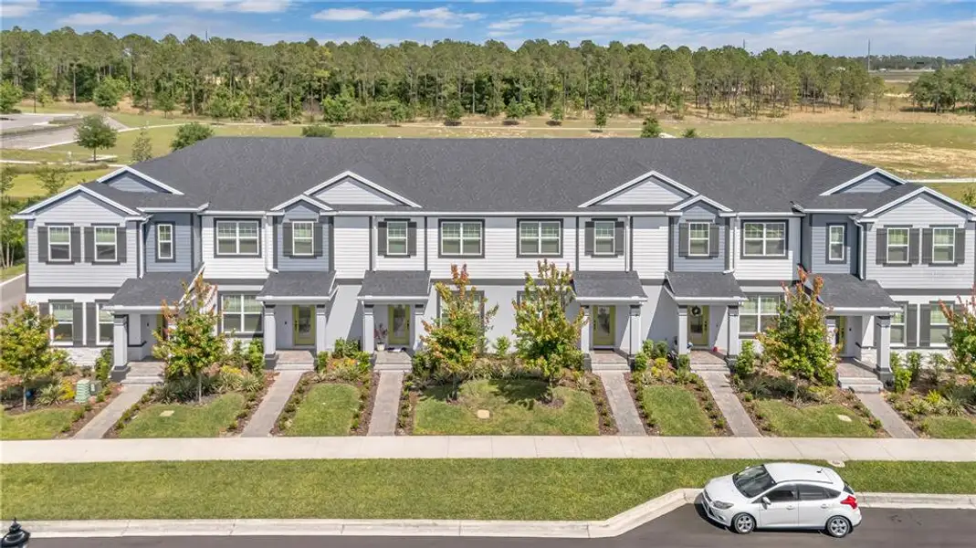 Front exterior of a new home in , Winter Garden, FL, highlighting curb appeal (Image 21).