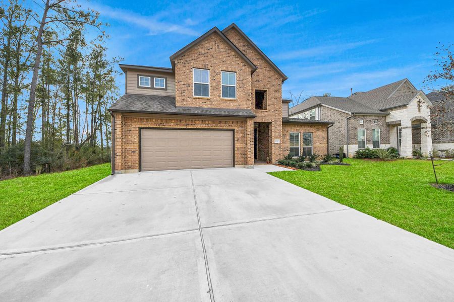 Front exterior of a new home in , Conroe, TX, highlighting curb appeal (Image 22).