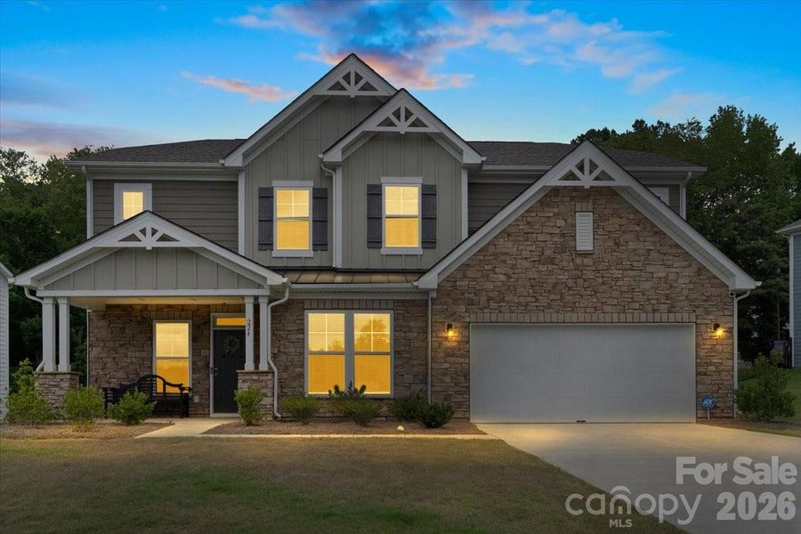 Front exterior of a new home in Sanders Ridge, Troutman, NC, highlighting curb appeal (Image 26).