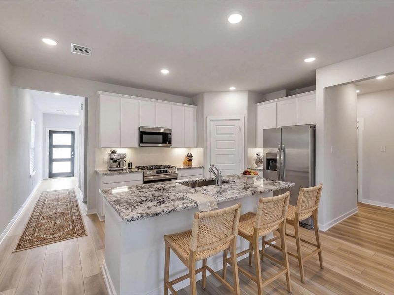 Furnished interior view inside a new home in Sunterra, Katy (Image 7).