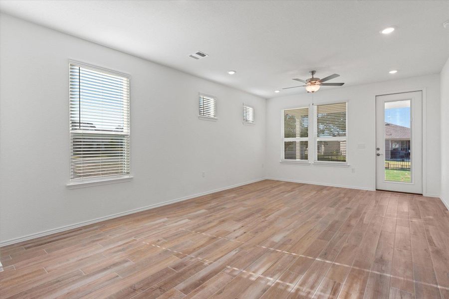Unfurnished room with light wood-type flooring, recessed lighting, and a ceiling fan
