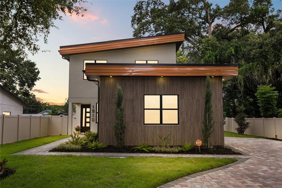 Front exterior of a new home in , Orlando, FL, highlighting curb appeal (Image 30).