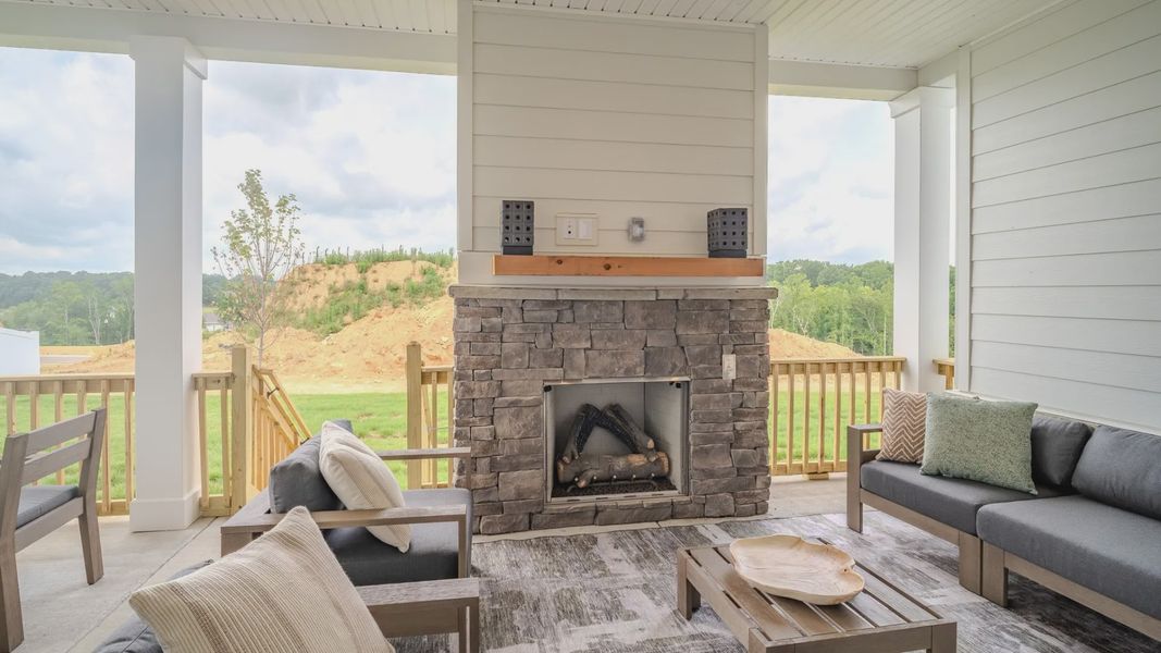 Spacious rear covered patio with fireplace Spacious rear covered patio with fireplace