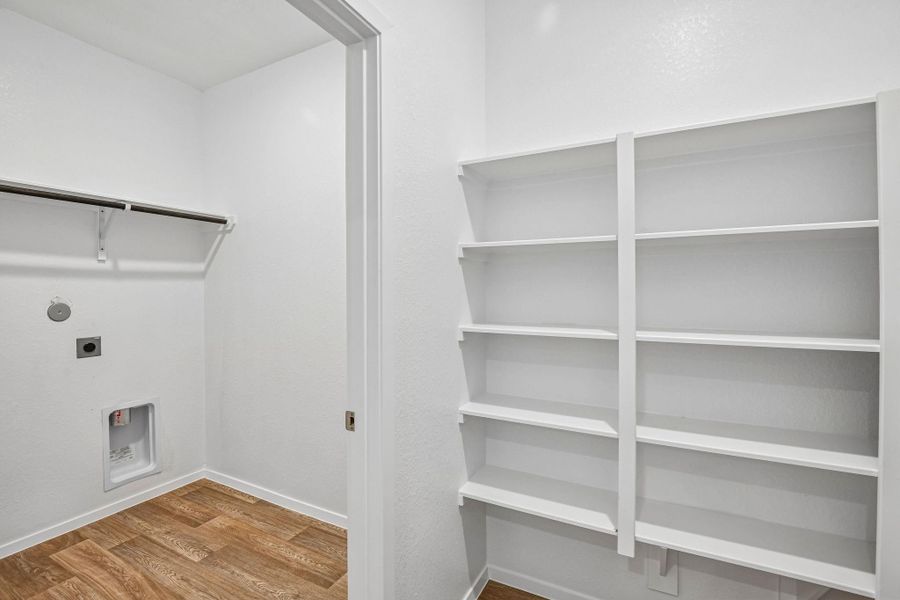 The utility room makes managing everyday tasks easy while keeping everything neat and accessible.