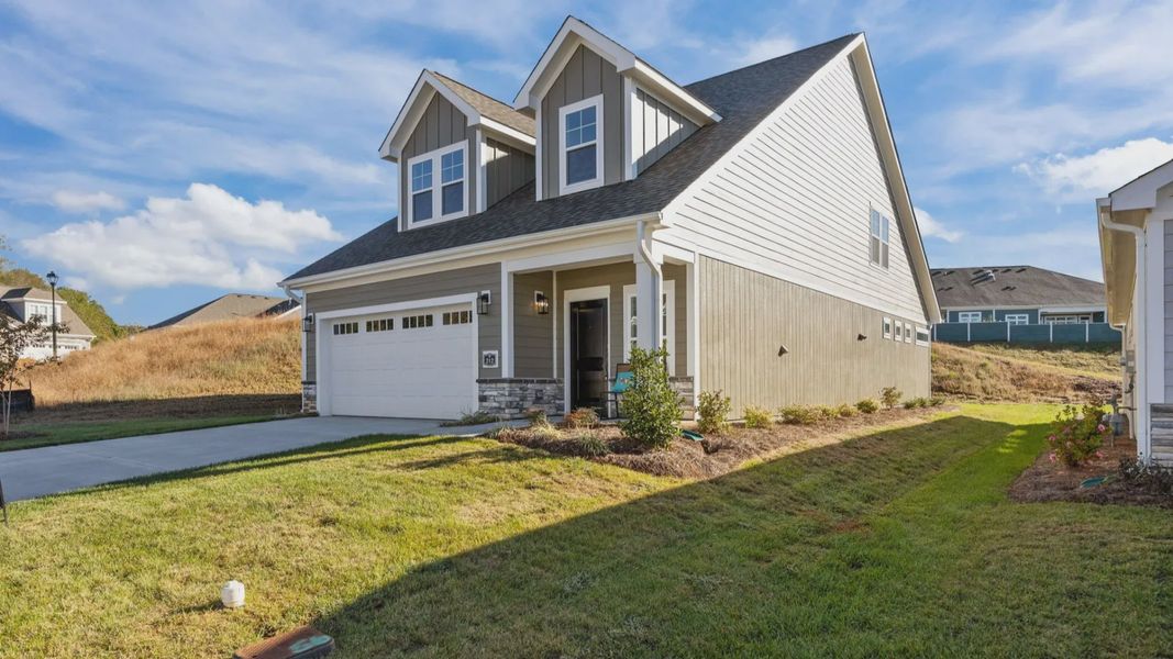 Front exterior of a new home in Village at Maple Leaf Farm, King, NC, highlighting curb appeal (Image 26).