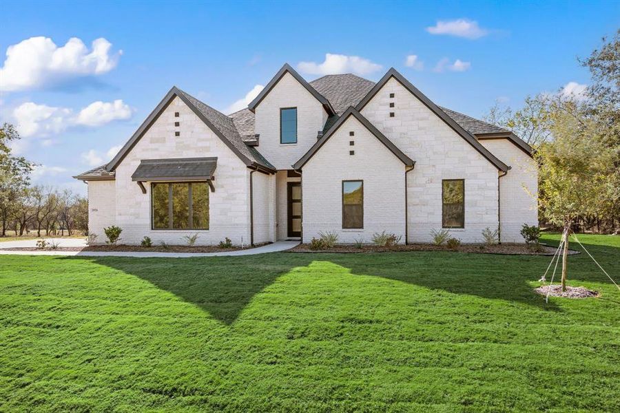 Front exterior of a new home in Rolling Creek Ranch, Aledo, TX, highlighting curb appeal (Image 25). Front exterior of a new home in Rolling Creek Ranch, Aledo, TX, highlighting curb appeal (Image 25).