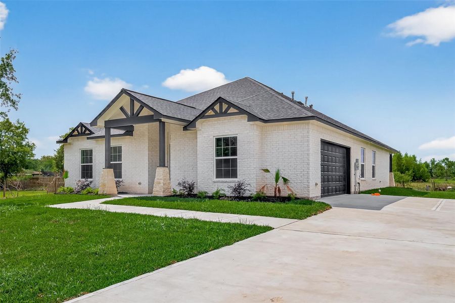 Front exterior of a new home in , Hitchcock, TX, highlighting curb appeal (Image 21).