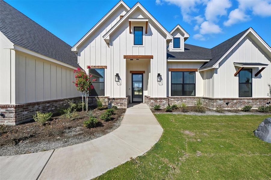 Front exterior of a new home in Eagles Bluff, Willow Park, TX, highlighting curb appeal (Image 21).