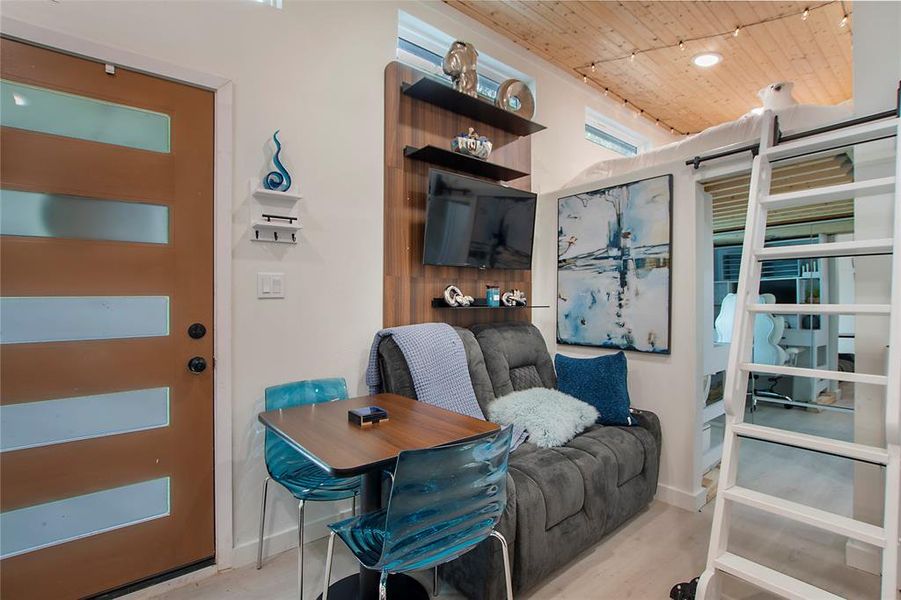 Home office featuring wooden ceiling and wood finished floors Home office featuring wooden ceiling and wood finished floors