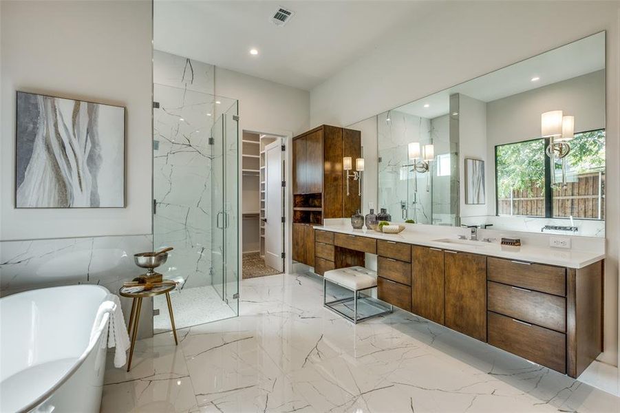 Bathroom with vanity, tile walls, and separate shower and tub