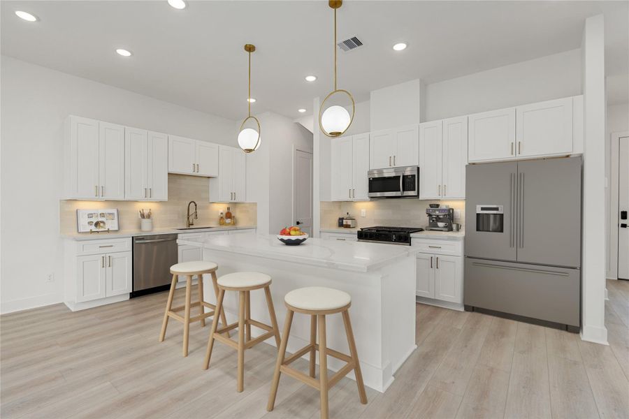 This stunning kitchen displays such a beautiful contrast with white cabinets, neutral paint, quartz countertops, modern backsplash, and SS appliances, quartz kitchen island with extra storage, breakfast bar, recessed lighting, high ceilings and pantry. This stunning kitchen displays such a beautiful contrast with white cabinets, neutral paint, quartz countertops, modern backsplash, and SS appliances, quartz kitchen island with extra storage, breakfast bar, recessed lighting, high ceilings and pantry.