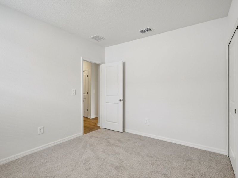 Spacious, unfurnished interior of a new home in The Grove at Stuart Crossing - Premier Series, Bartow (Image 13). Spacious, unfurnished interior of a new home in The Grove at Stuart Crossing - Premier Series, Bartow (Image 13).
