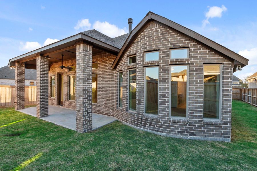 Exterior details and patio area of a home in Dunham Pointe, Cypress (Image 4).