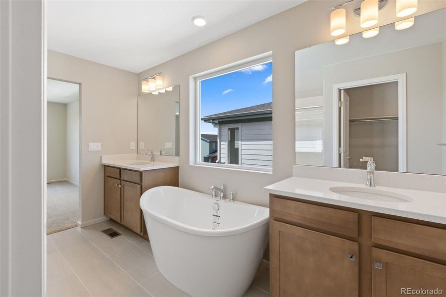 Furnished interior view inside a new home in Woodrose at Painted Prairie, Aurora (Image 13).