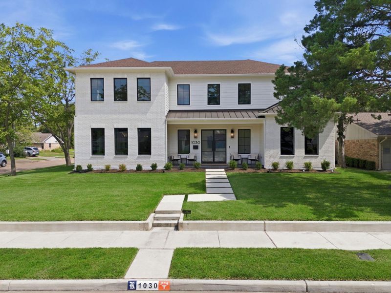 View from the street. Notice the grass, walkway, landscape and Incredible Double Glass Doors. View from the street. Notice the grass, walkway, landscape and Incredible Double Glass Doors.