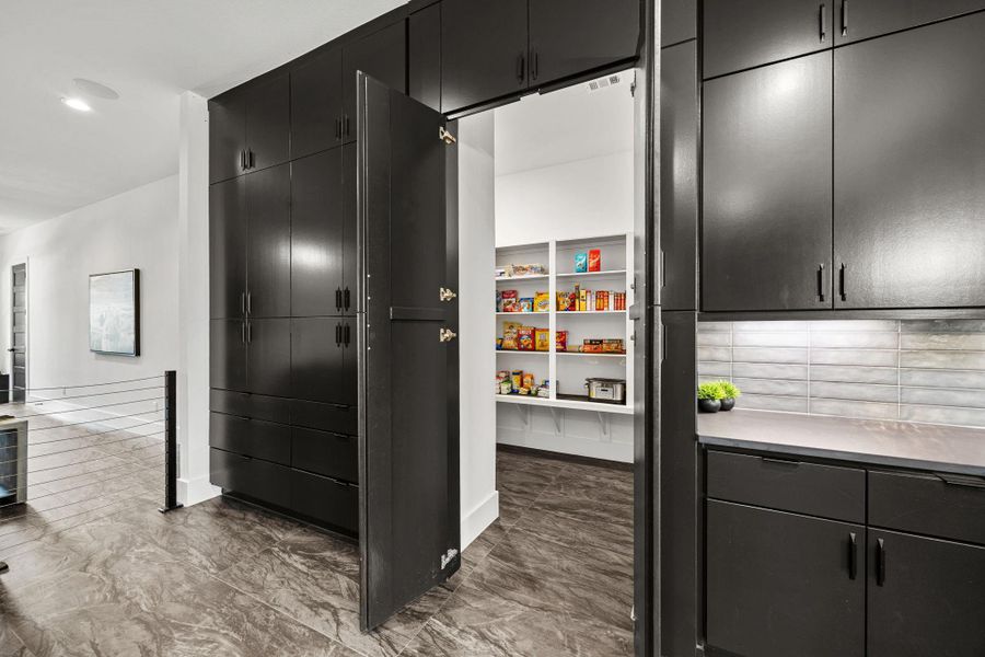 To top it off there is a hidden pantry that blends in with the custom cabinets! To top it off there is a hidden pantry that blends in with the custom cabinets!