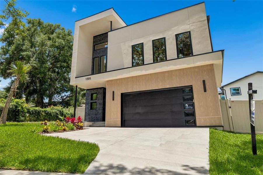 Front exterior of a new home in , Tampa, FL, highlighting curb appeal (Image 35).