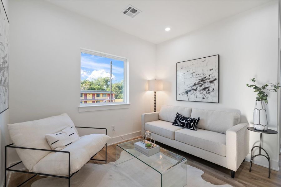 Upstairs offers a flexible space that can serve as a secondary living area, playroom, or home office. Its open design provides a versatile spot for family activities or quiet relaxation. This adaptable area adds functionality and extra living space to the home.