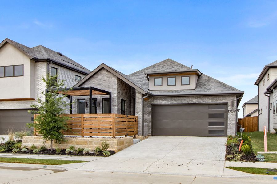 Front exterior of a new home in Willow Grove Single-Family Homes, Melissa, TX, highlighting curb appeal (Image 2). Front exterior of a new home in Willow Grove Single-Family Homes, Melissa, TX, highlighting curb appeal (Image 2).