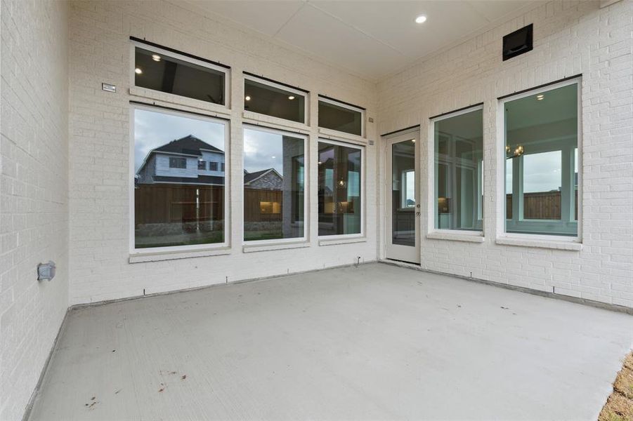 Dining al fresco is in your future on this magnificent covered back patio!