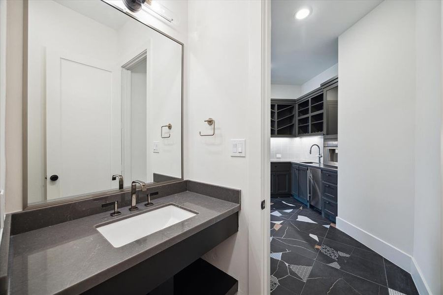 The office includes a dedicated half bath, designed for your convenience and comfort. This well-appointed space ensures that you have easy access to restroom facilities without having to leave your workspace.