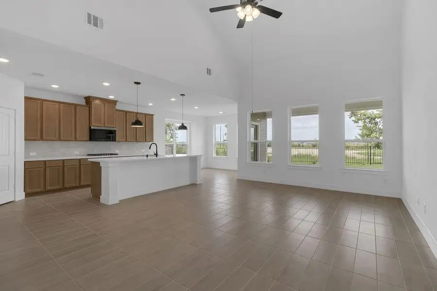 The open layout invites laughter and warmth, making it the perfect backdrop for family gatherings or cozy brunches with friends.