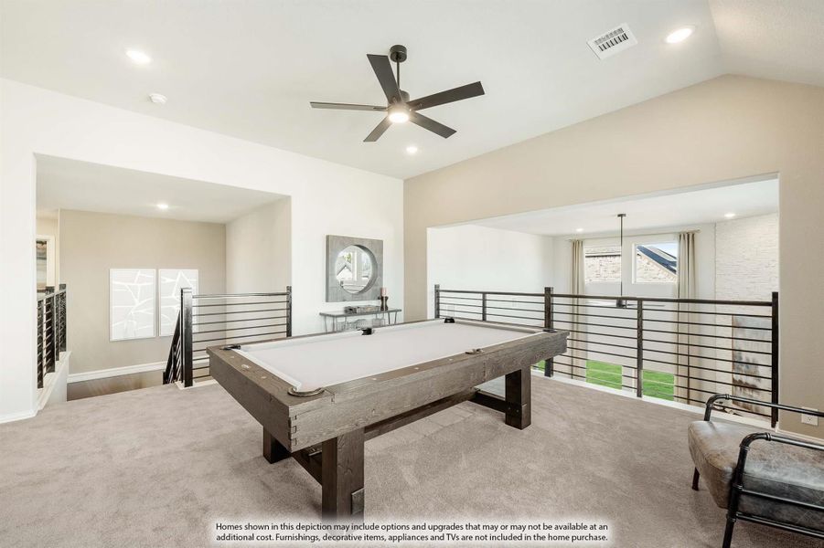 Upstairs game room with pool table, vaulted ceiling, ceiling fan, and open metal railing overlooking lower level