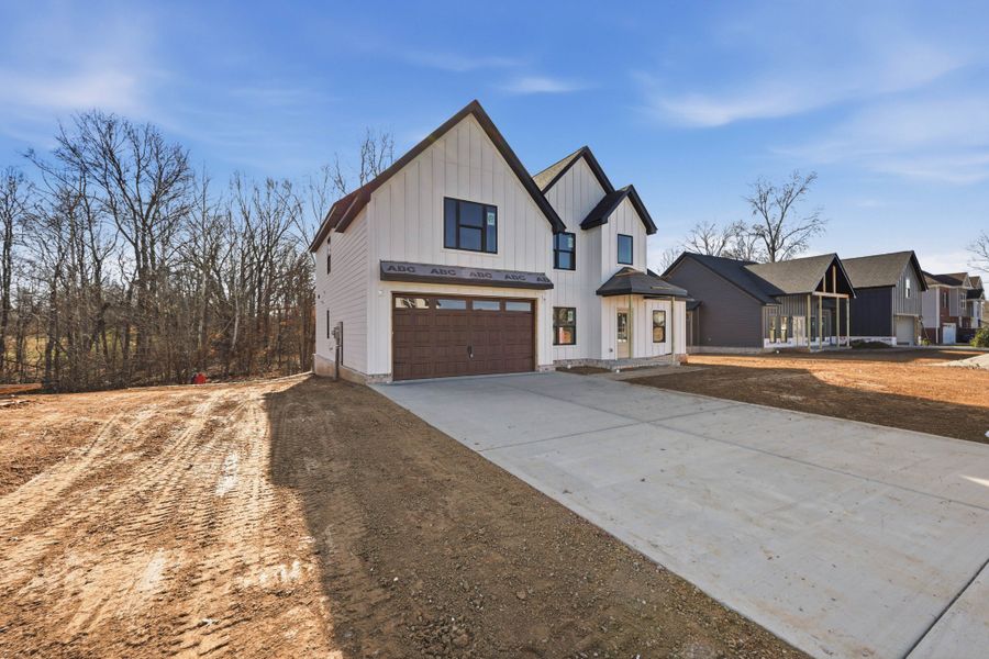 Front exterior of a new home in Bellshire, Clarksville, TN, highlighting curb appeal (Image 8). Front exterior of a new home in Bellshire, Clarksville, TN, highlighting curb appeal (Image 8).