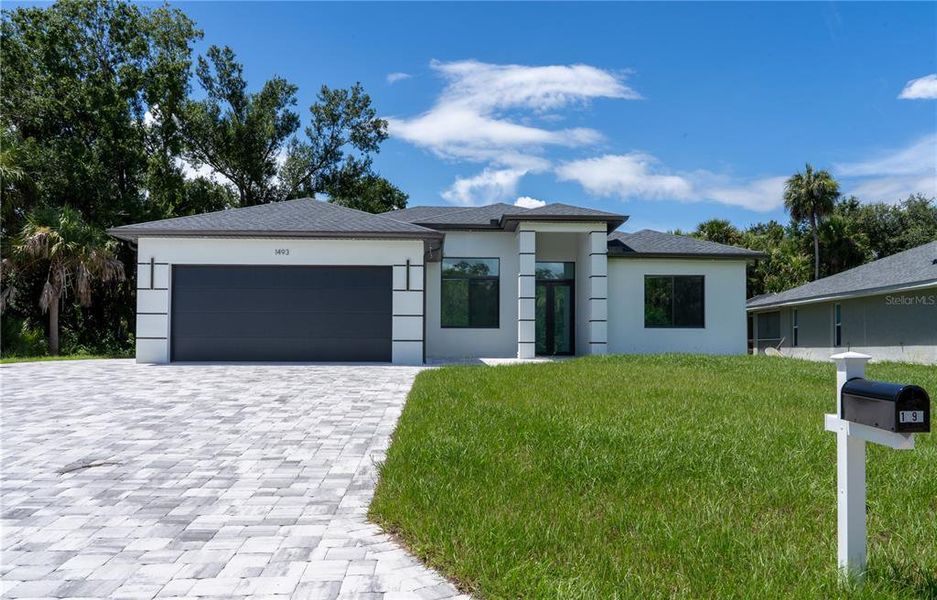Front exterior of a new home in , North Port, FL, highlighting curb appeal (Image 29).