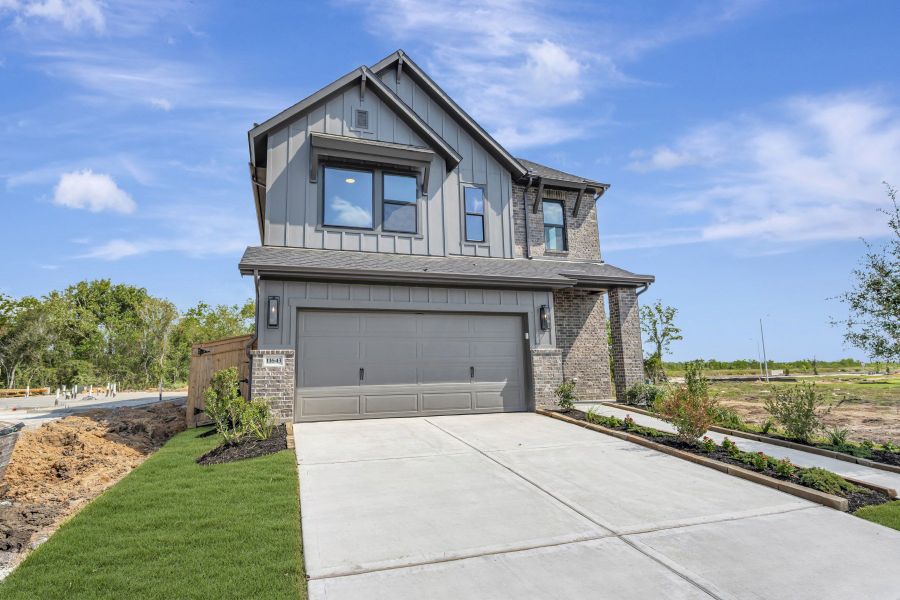 Front exterior of a new home in Sienna - Grove Collection, Missouri City, TX, highlighting curb appeal (Image 27).