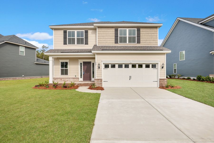 Front exterior of a new home in Wexford, Richmond Hill, GA, highlighting curb appeal (Image 2).