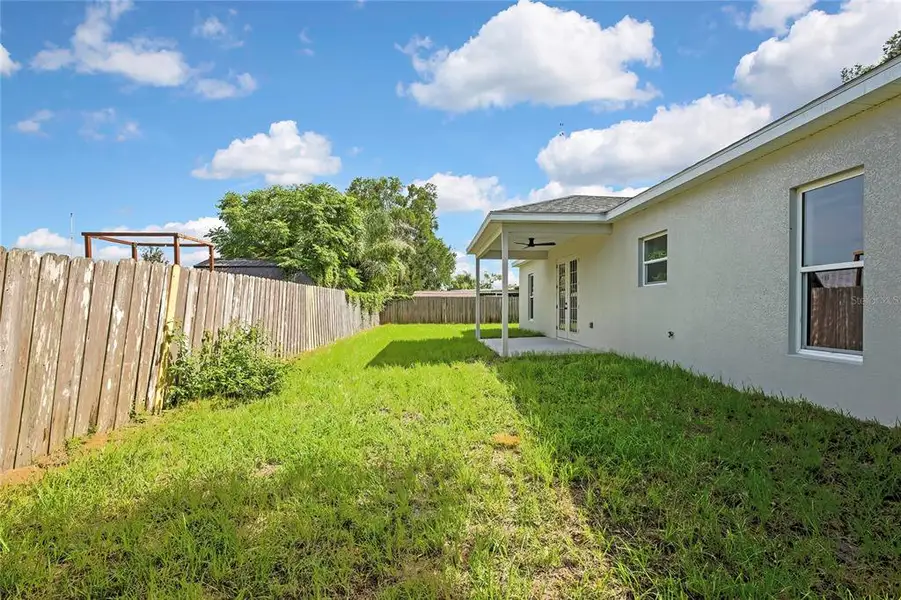 Exterior details and patio area of a home in , Dade City (Image 4).