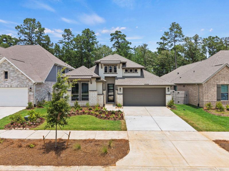 Front exterior of a new home in Two Step Farm, Montgomery, TX, highlighting curb appeal (Image 2). Front exterior of a new home in Two Step Farm, Montgomery, TX, highlighting curb appeal (Image 2).