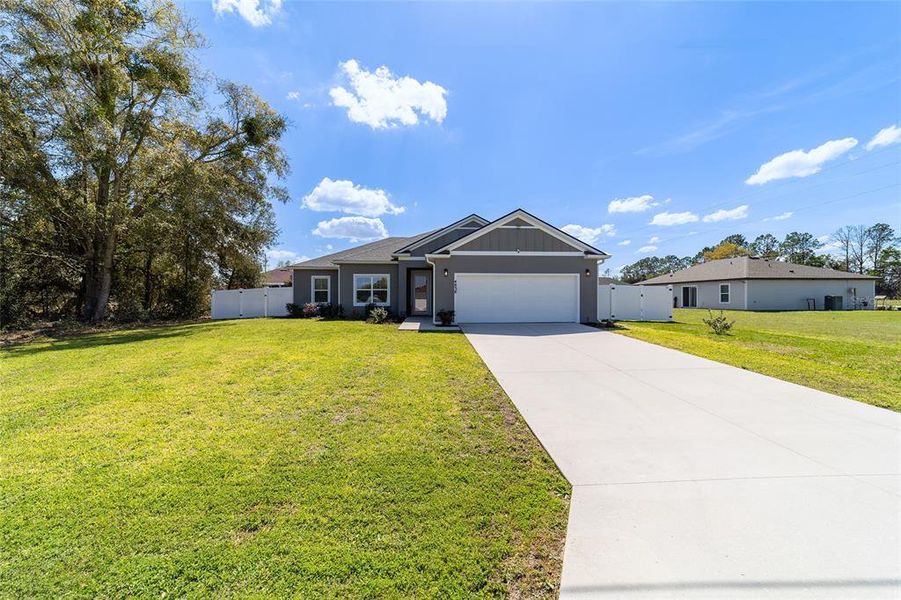 Front exterior of a new home in , Ocala, FL, highlighting curb appeal (Image 2). Front exterior of a new home in , Ocala, FL, highlighting curb appeal (Image 2).