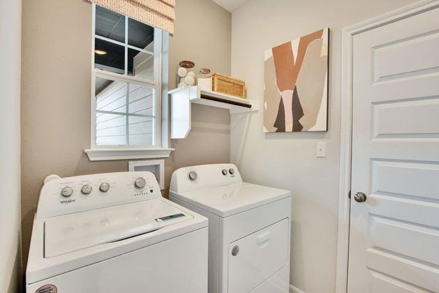Laundry area with washing machine and clothes dryer and laundry area