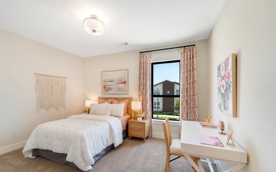 Representative furnished interior of a home built from the Rainier by CastleRock Communities in The Summit at Center Stage, Keller (Image 19).