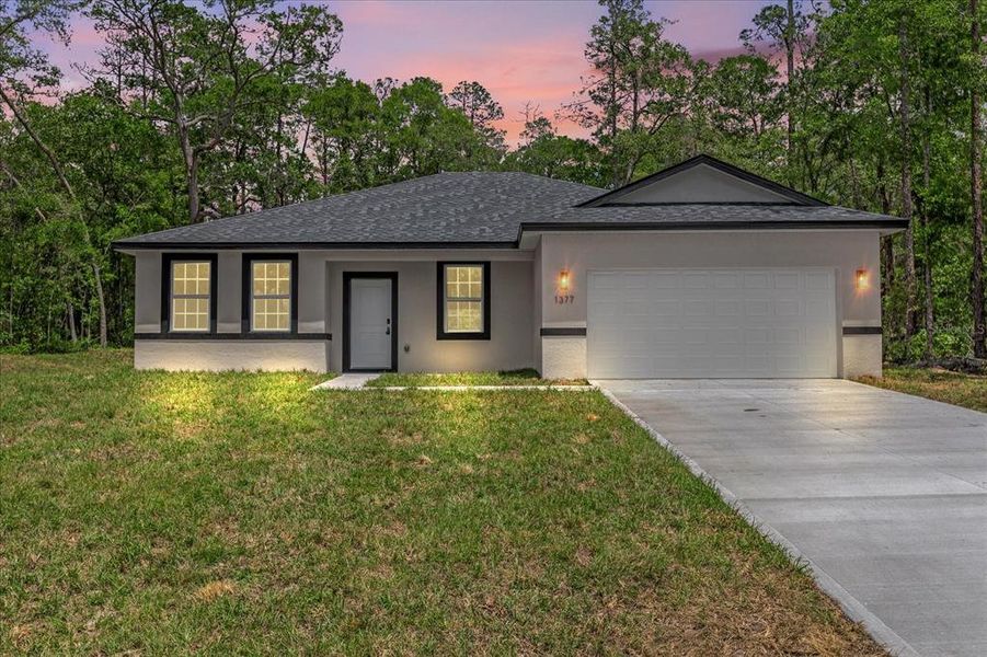 Front exterior of a new home in , Citrus Springs, FL, highlighting curb appeal (Image 20).
