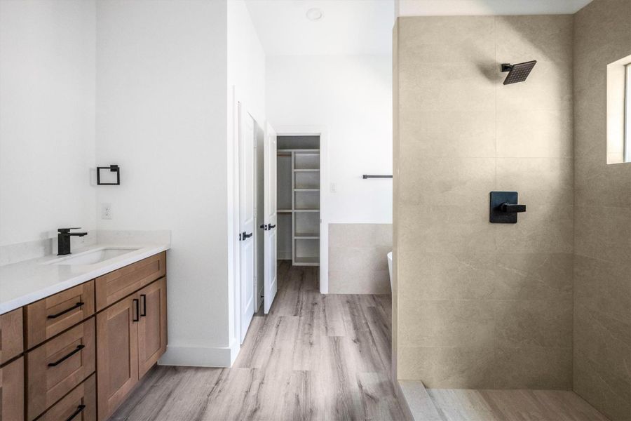 Primary Bathroom features double sinks, soaking tub & relaxing stand up shower.
