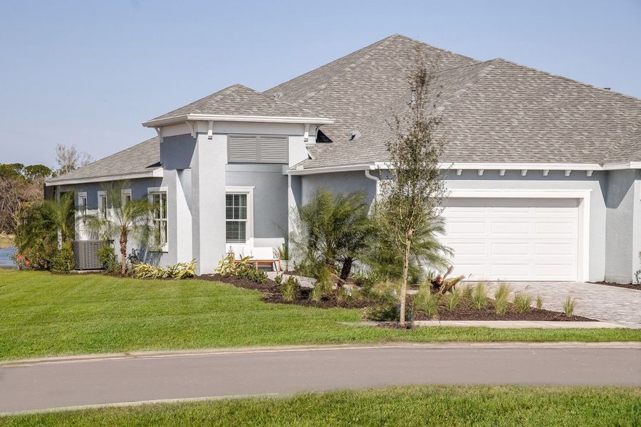Front exterior of a new home in Wildleaf, Parrish, FL, highlighting curb appeal (Image 2).