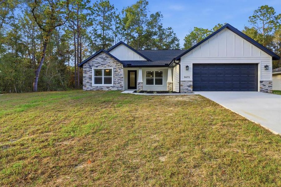 Front exterior of a new home in , Inverness, FL, highlighting curb appeal (Image 21).