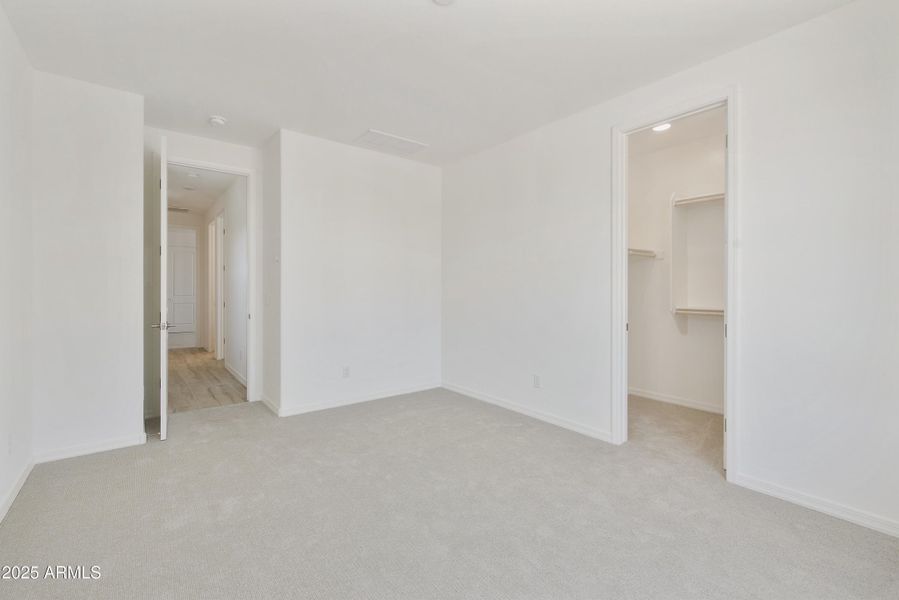 FRONT BEDROOM WITH W/ WALK IN CLOSET