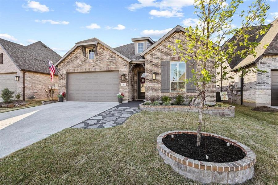 Front exterior of a new home in Gateway Village - The Reserve, Denison, TX, highlighting curb appeal (Image 21).