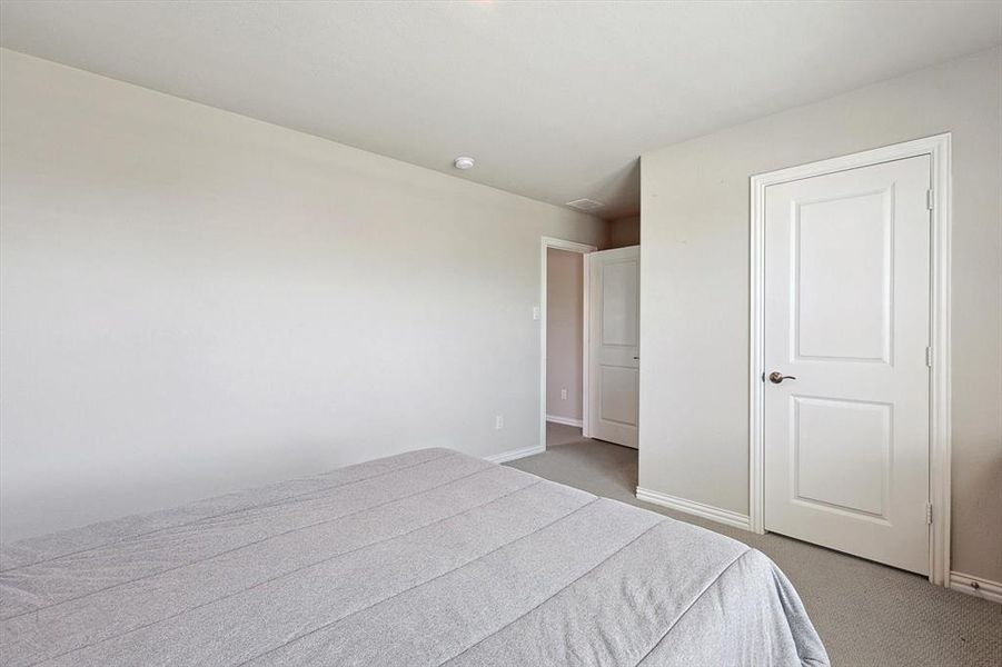 Unfurnished bedroom with carpet flooring